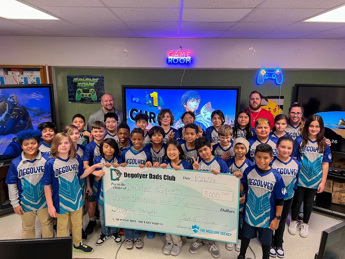 The McClure Agency sponsoring the DeGolyer Dads Club's $3,000 donation to DeGolyer eSports